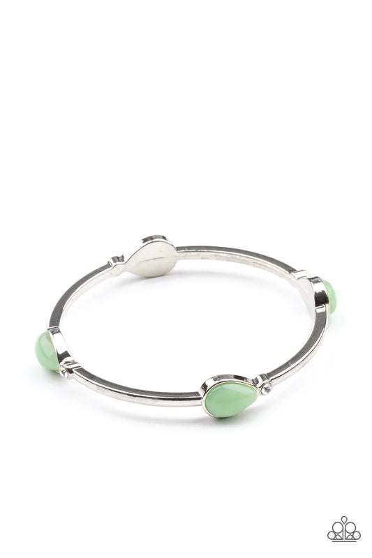 Pairs of glassy Green Ash teardrops and dainty white rhinestones embellish a classic silver bangle, creating a dreamy display around the wrist.  Sold as one individual bracelet.
