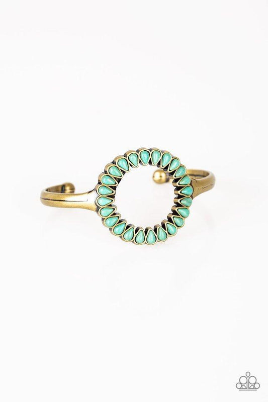 Chiseled into tranquil teardrops, refreshing turquoise stones spin around the center of an antiqued brass cuff for a seasonal look.  Sold as one individual bracelet.