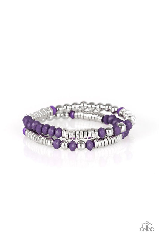 Classic silver beads, faceted purple beads, and dainty silver discs are threaded along stretchy bands, creating shimmery layers across the wrist.

Sold as one set of two bracelets.