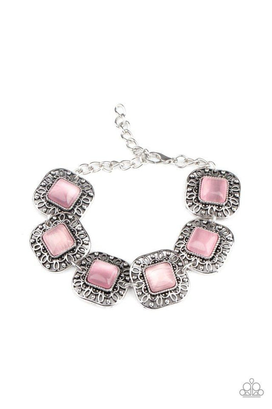 Dotted with pink cat's eye stones, square filigree filled silver frames delicately link around the wrist for a dreamy display. Features an adjustable clasp closure.  Sold as one individual bracelet.