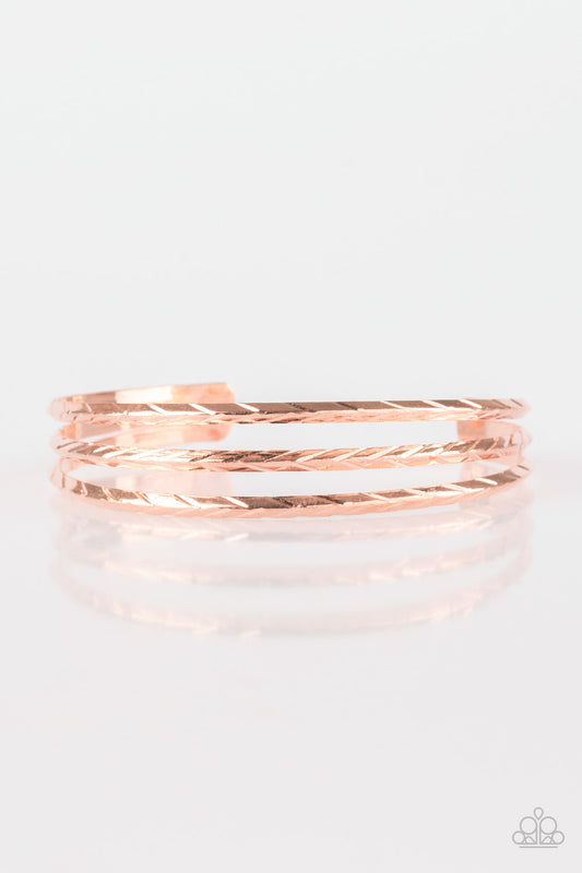 Etched in shimmery geometric patterns, glistening silver bars arc across the wrist, coalescing into a dainty cuff.  Sold as one individual bracelet.