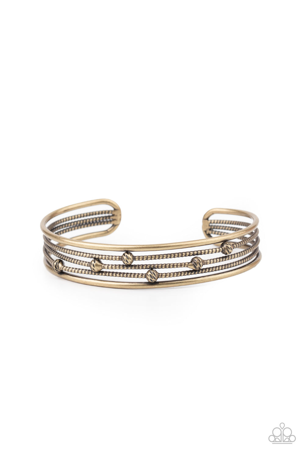 Dotted in ornate brass beads, textured brass wires layer between two smooth brass bars, stacking into an edgy cuff around the wrist.  Sold as one individual bracelet.