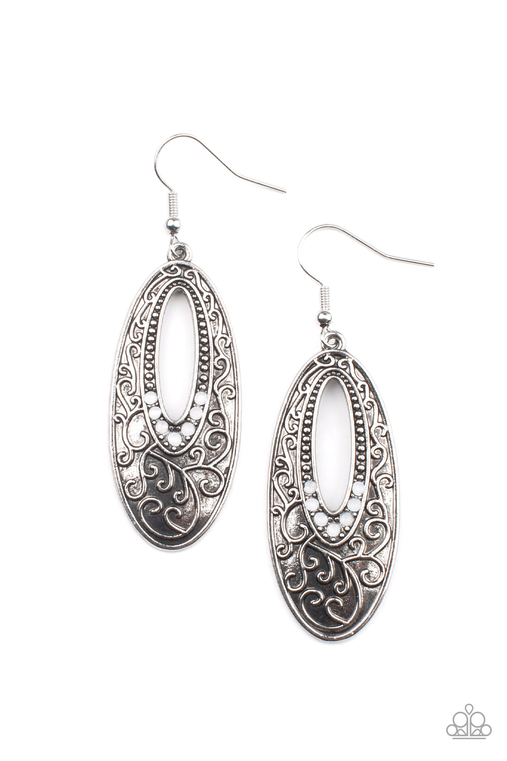 Dainty silver studs fade into dewy white rhinestones around the airy center of an oval silver frame that is embossed in vine-like scroll, creating an ethereally whimsical frame. Earring attaches to a standard fishhook fitting.  Sold as one pair of earrings.