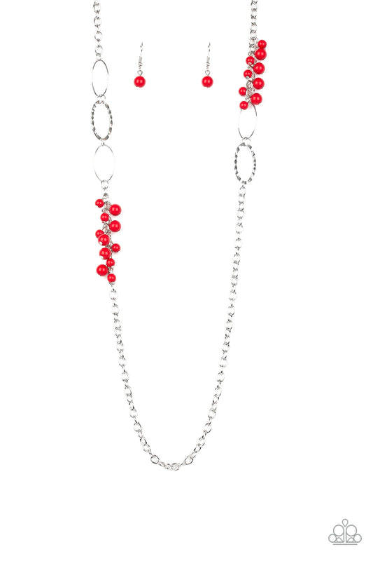 Smooth and hammered silver rings join clusters of fiery red beads along a shimmery silver chain for a colorful look. Features an adjustable clasp closure.

Sold as one individual necklace. Includes one pair of matching earrings.