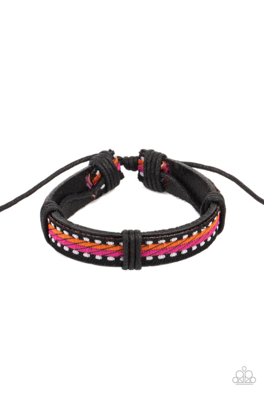 Featuring orange, pink, and white thread, a decorative textile is knotted in place across the front of a dainty brown leather band for an adventurous look. Features an adjustable sliding knot closure.  Sold as one individual bracelet.