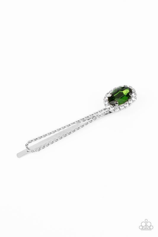 Bordered in a ring of glassy white rhinestones, an oval green gem adorns the corner of a textured silver bobby pin for a glamorous finish.  Sold as one individual decorative bobby pin.