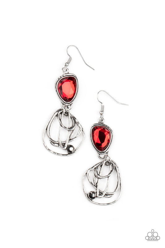 Encased in a stacked silver frame, an asymmetrical red gem gives way to a dizzyingly abstract silver frame dotted with a single hematite rhinestone for an edgy finish. Earring attaches to a standard fishhook fitting.  Sold as one pair of earrings.
