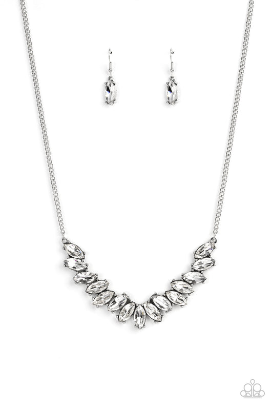 Featuring pronged silver fittings, a sparkly series of white marquise cut rhinestones fan out below the collar for a stellar statement-making look. Features an adjustable clasp closure.  Sold as one individual necklace. Includes one pair of matching earrings.