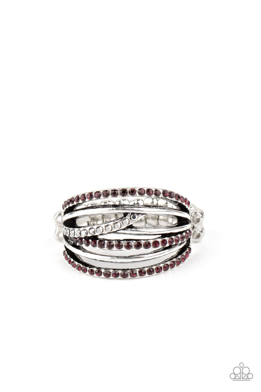 Sporadically dotted in sections of purple and hematite rhinestones, glittery bands crisscross and layer with smooth silver bars across the finger for an edgy look. Features a stretchy band for a flexible fit.  Sold as one individual ring.