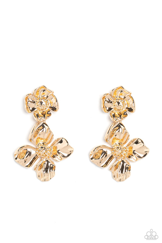 Featuring a warped metallic texture, an oversized gold flower hangs from a smaller gold flower for a whimsical finish. Dainty gold studs coalesce the centers of each flower, adding tactile detail to the floral design. Earring attaches to a standard post fitting.  Sold as one pair of post earrings.