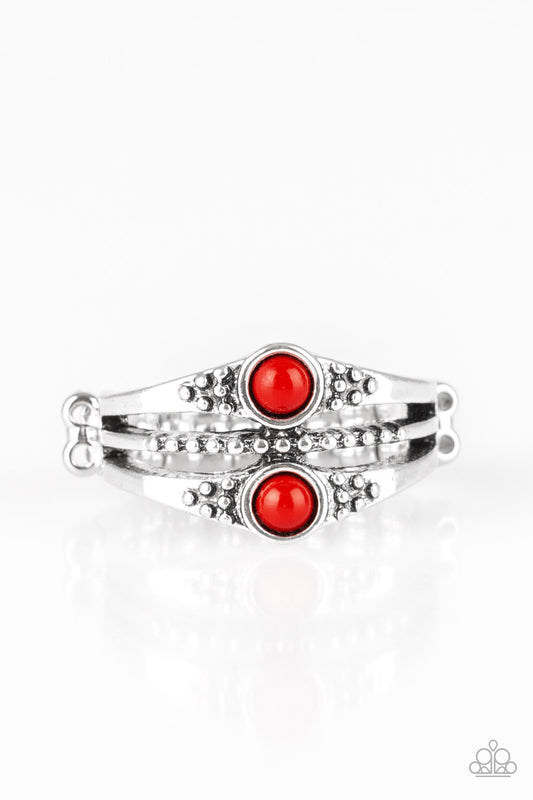 Dotted in shimmery silver studs, antiqued silver bands stack across the finger. Two shiny red beads are pressed into the upper and lower bands for a colorful finish. Features a dainty stretchy band for a flexible fit.  Sold as one individual ring.