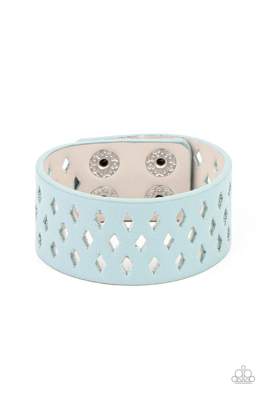 A wide blue leather band is filled with patterned rows of small diamond-shaped cutouts giving the illusion of diamonds floating across the wrist in a whimsical fashion. Features an adjustable snap closure.  Sold as one individual bracelet.