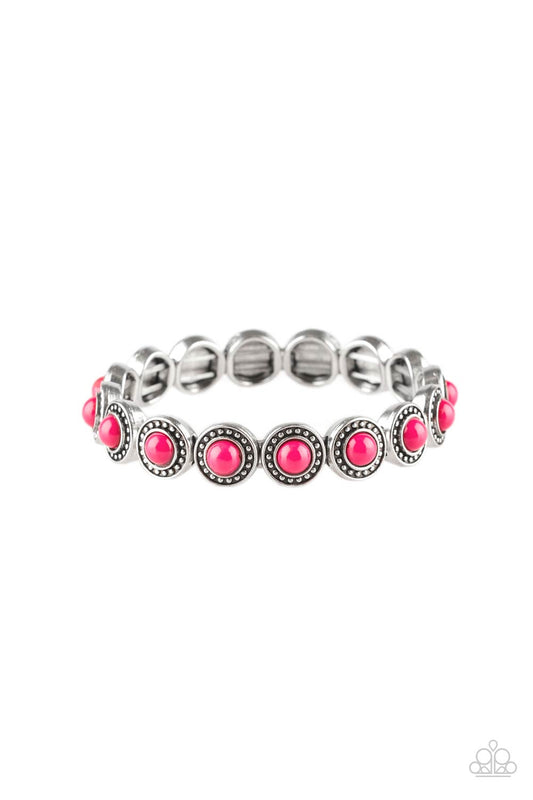 Dotted with vivacious pink beaded centers, studded silver frames are threaded along stretchy elastic bands and linked around the wrist for a whimsical look.  Sold as one individual bracelet.