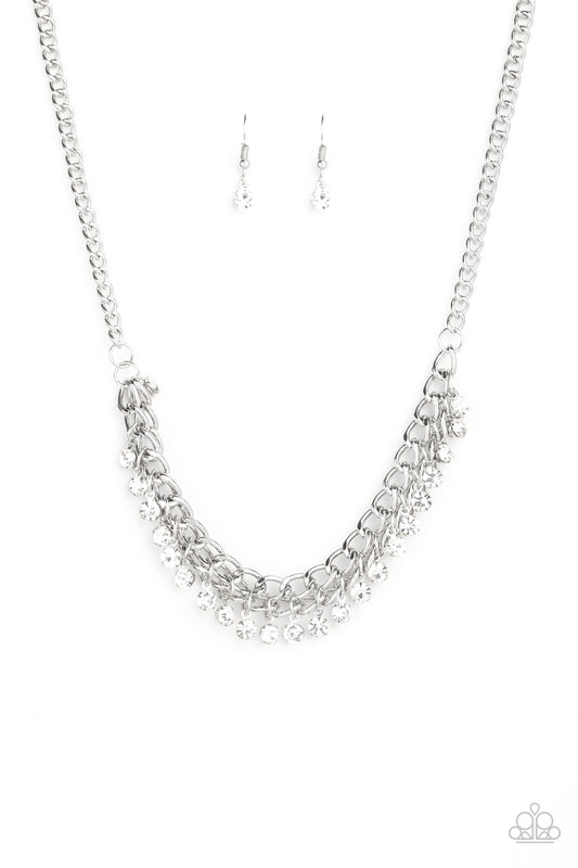 A fringe of glittery white rhinestones swings from the bottom of a bold silver chain below the collar for a fierce look. Features an adjustable clasp closure.  Sold as one individual necklace. Includes one pair of matching earrings.
