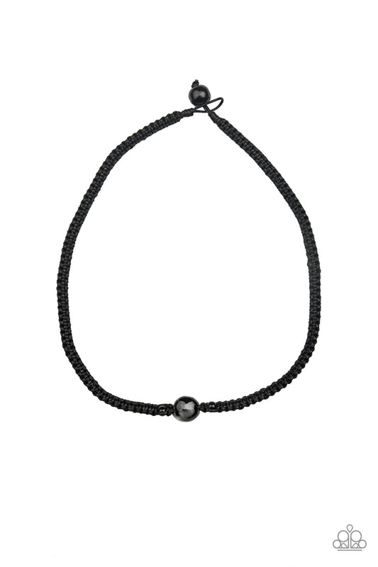 Flanked by dainty black beads, a glassy bead is knotted in place along a black braided cord for a seasonal look. Features a button loop closure.  Sold as one individual necklace.
