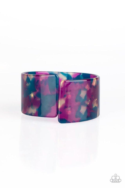 Smudged in blue and purple, an iridescent acrylic cuff asymmetrically wraps around the wrist, creating a tilted opening for a retro finish.  Sold as one individual bracelet.