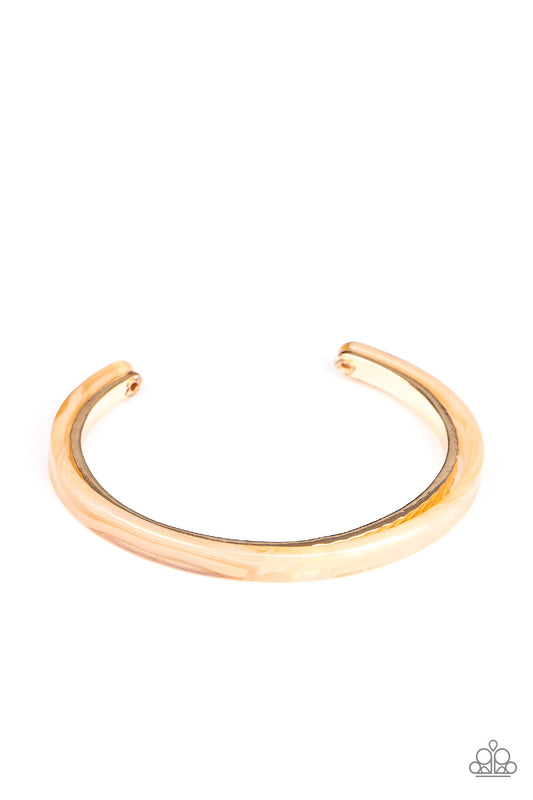 Featuring a marble-like finish, a golden acrylic frame curls around a dainty gold cuff, creating a colorfully stacked look across the wrist.  Sold as one individual bracelet.