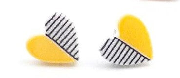 Kids' heart shaped earrings with yellow on one half and black and white stripes on the other half