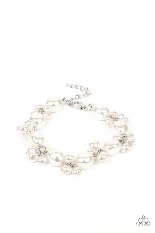 Featuring imperfect finishes, clusters of dainty pearly beads and pearly faceted beads delicately link around the wrist, creating a timeless fringe. Features an adjustable clasp closure.

Sold as one individual bracelet.