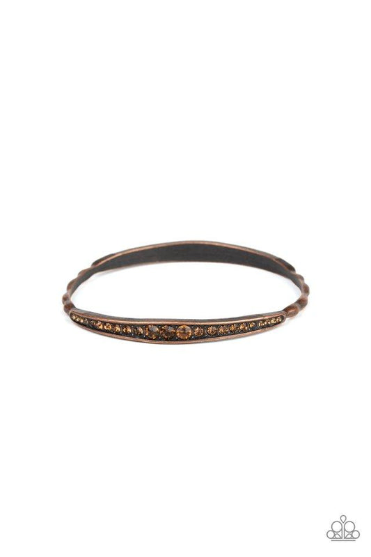 Gradually increasing in size at the center, two sections of topaz rhinestones are encrusted along a dainty copper bangle rippling with wavy textures for a timeless twist.  Sold as one individual bracelet.