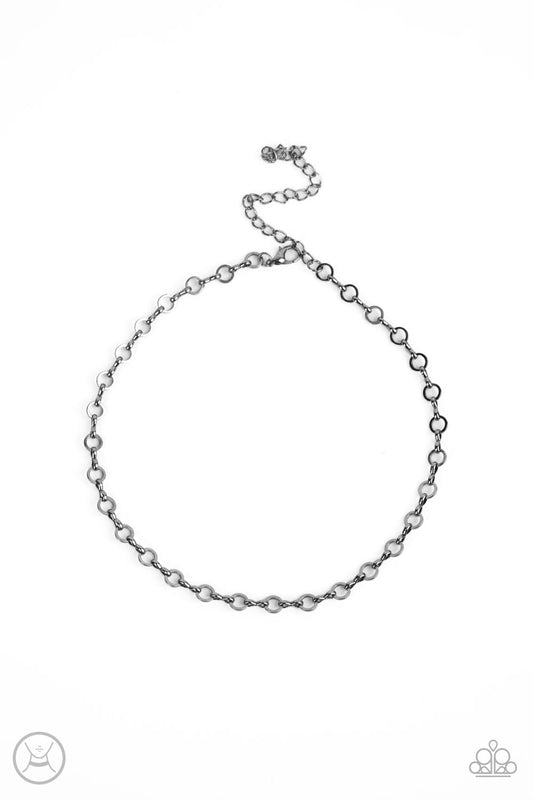 Dainty silver rings alternate with pinched silver links around the neck, creating a chic minimalist inspired look. Features an adjustable clasp closure.  Sold as one individual choker necklace. Includes one pair of matching earrings.