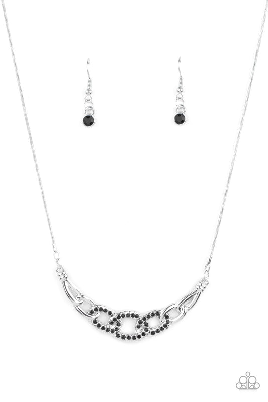 Shiny silver links, encrusted with dainty Jet Black rhinestones, connect into a glamorous centerpiece below the collar. Features an adjustable clasp closure.  Sold as one individual necklace. Includes one pair of matching earrings.