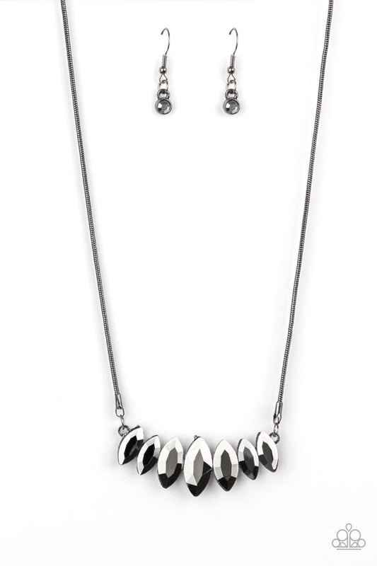 Gradually increasing in size near the center, glittery hematite marquise shaped gems link below the collar for a dramatic look. Features an adjustable clasp closure.  Sold as one individual necklace. Includes one pair of matching earrings.