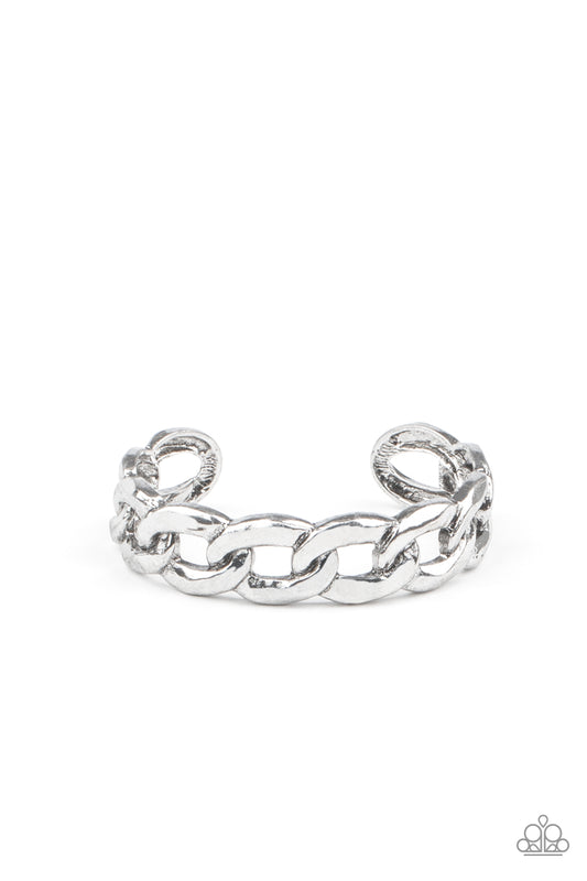Brushed in an antiqued shimmer, oversized silver chain links boldly connect into a gritty cuff around the wrist.  Sold as one individual bracelet.