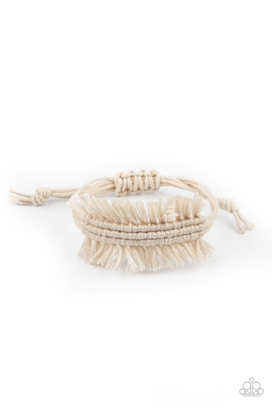 Strands of shiny white twine-like cording decoratively knot around the wrist, creating a rustic fringed centerpiece. Features an adjustable sliding knot closure.  

Sold as one individual bracelet.