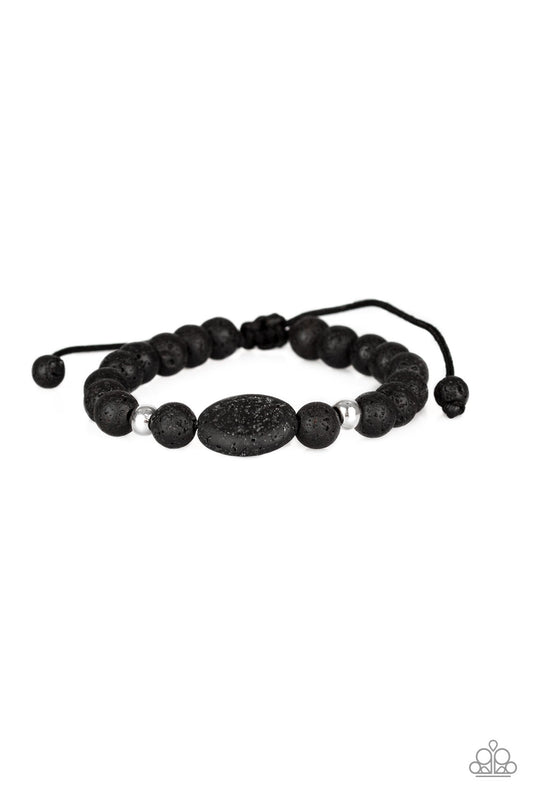Infused with dainty silver accents, a collection of black lava rock beads are threaded along a shiny black cord around the wrist for a seasonal look. Features an adjustable sliding knot closure.  Sold as one individual bracelet.
