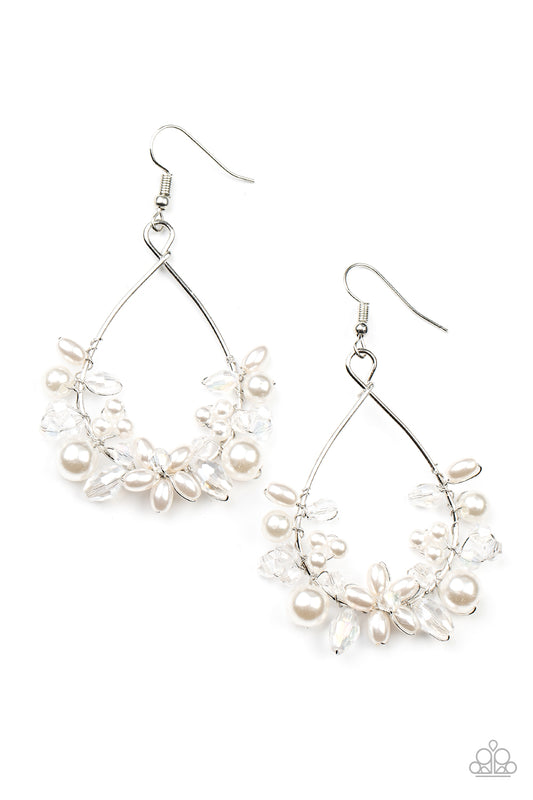 A bubbly collection of white pearls and white crystal-like beads are threaded along the bottom of a dainty wire hoop, creating twinkly floral accents. Earring attaches to a standard fishhook fitting.  Sold as one pair of earrings.