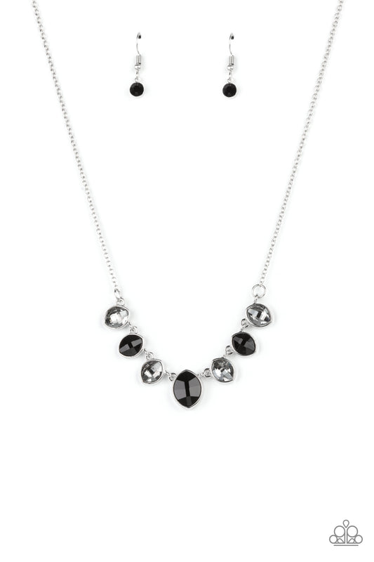 Encased in sleek silver fittings, elegant cut smoky and black rhinestones delicately connect below the collar. An oversized black rhinestone adorns to the middle of the glittery strand, creating a sparkly centerpiece. Features an adjustable clasp closure.  Sold as one individual necklace. Includes one pair of matching earrings.