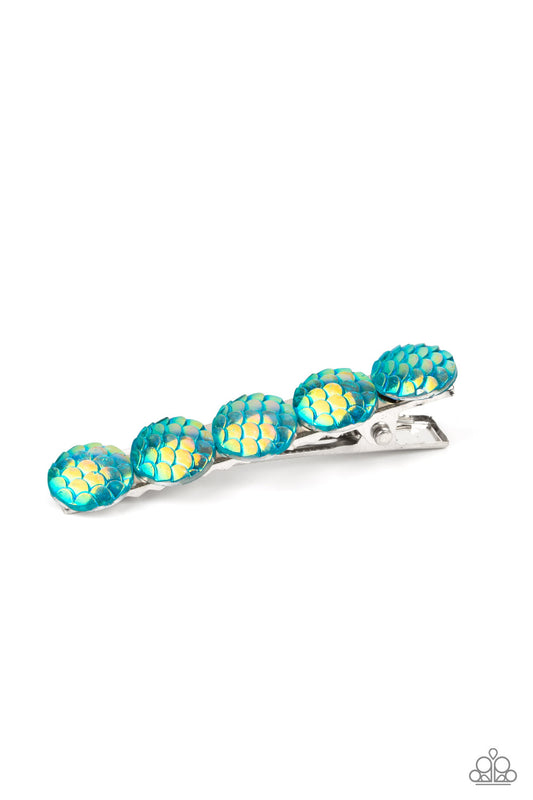 Brushed in an iridescent finish, a row of blue scale-like beads adorn the front of a rectangular silver frame for a Mer-mazing finish. Features a standard hair clip on the back.  Sold as one individual hair clip.