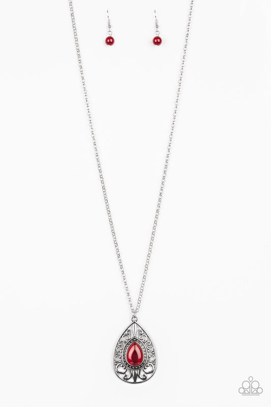 A glowing red moonstone is pressed into the center of a silver teardrop pendant swirling with regal filigree for a regal finish. Features an adjustable clasp closure.  Sold as one individual necklace. Includes one pair of matching earrings.