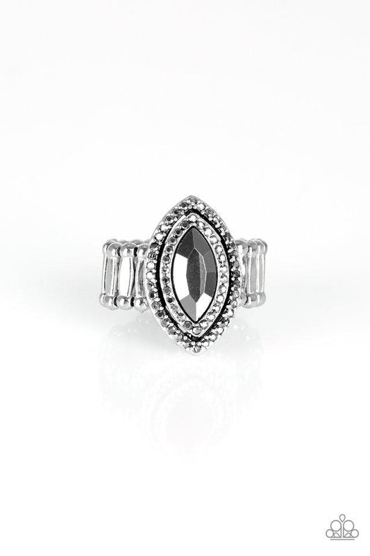 Featuring a regal marquise style cut, a glittery hematite gem is pressed into the center of stacked silver frames radiating with glittery hematite rhinestones for a glamorous finish. Features a stretchy band for a flexible fit.  Sold as one individual ring.