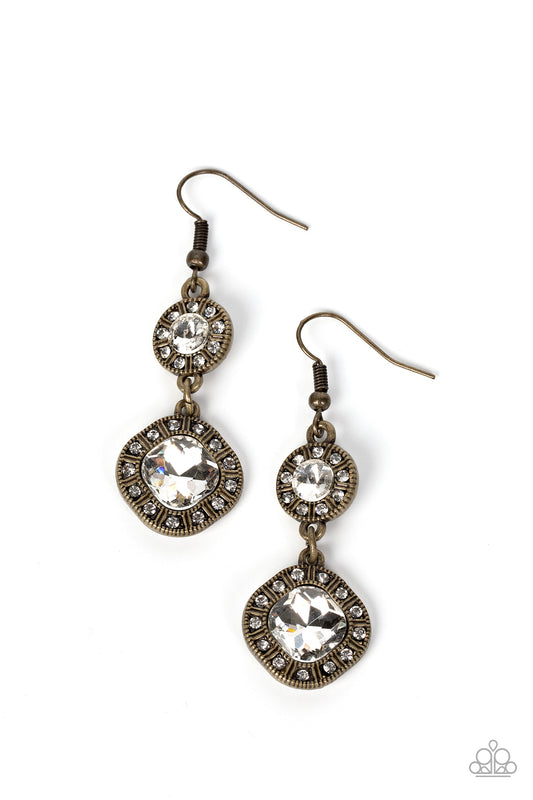 Separated by brass bars, dainty white rhinestones circle into studded borders around a pair of round and radiant cut white rhinestone centers that delicately link into an extravagant lure. Earring attaches to a standard fishhook fitting.  Sold as one pair of earrings.