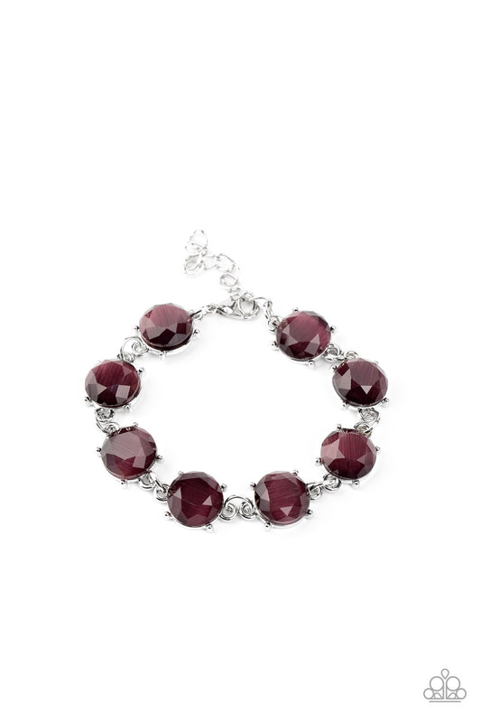 A glowing collection of faceted purple cat's eye stone frames delicately connect across the wrist for an ethereal look. Features an adjustable clasp closure.

Sold as one individual bracelet.