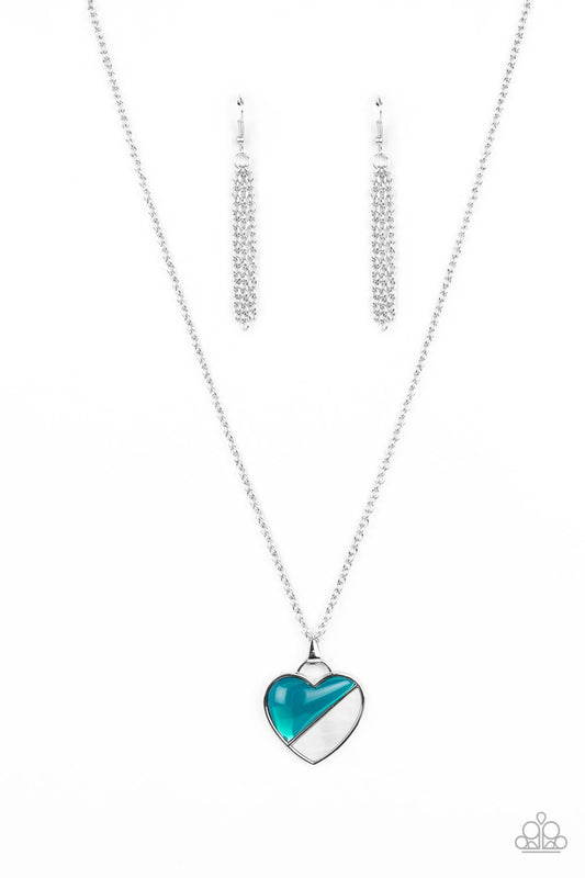 Encased in a silver heart frame, a glassy Harbor Blue bead and white shell-like stone lay side-by-side, creating a romantic pendant at the bottom of a classic silver chain. Features an adjustable clasp closure.  Sold as one individual necklace. Includes one pair of silver fringe earrings.