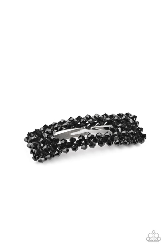 Faceted black crystal-like beads bedazzle the front of a rectangular hair clip for a sparkly finish. Features a standard snap clip on the back.  Sold as one individual hair clip.