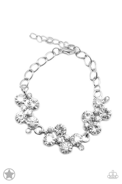 Connecting to a classic silver chain, clusters of dazzling white rhinestones drape elegantly along the wrist. Daintier white rhinestones are sprinkled between the larger rhinestones, creating additional luminous detail to the timeless design. Features an adjustable clasp closure.  Sold as one individual bracelet.