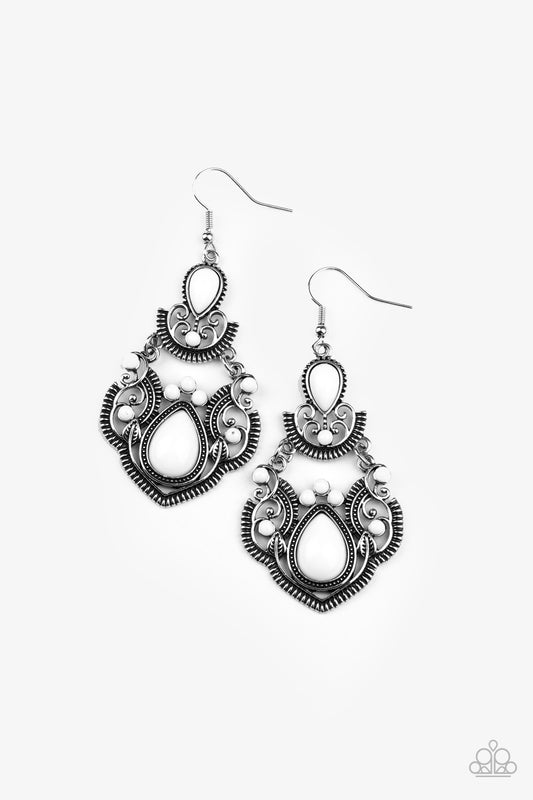 Dotted with round and teardrop white beads, a stacked silver frame radiating with studded and linear detail swings from the ear for a colorfully regal look. Earring attaches to standard fishhook fitting.

Sold as one pair of earrings.