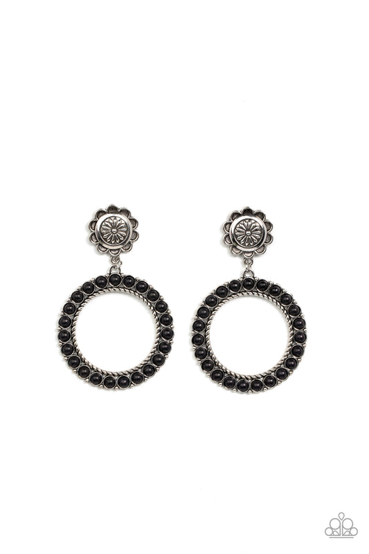 Featuring studded and twisted rope-like silver accents, a black stone dotted hoop swings from the bottom of a rustic silver flower for a whimsically floral fashion. Earring attaches to a standard post fitting.  Sold as one pair of post earrings.