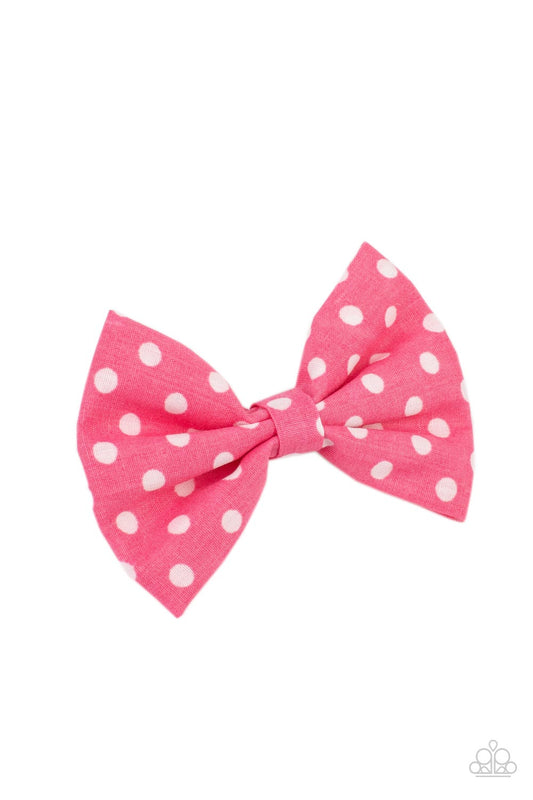 Delightful pink polka-dotted cotton fabric delicately knots into a dainty bow. Features a standard hair clip on the back.  Sold as one individual hair clip.