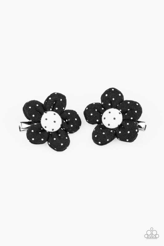 Dotted in dainty white polka dots, puffy black petals bloom from matching white button-top centers featuring black polka dots, creating a playful pair of flowers. Each flower features a standard hair clip on the back.  Sold as one pair of hair clips.