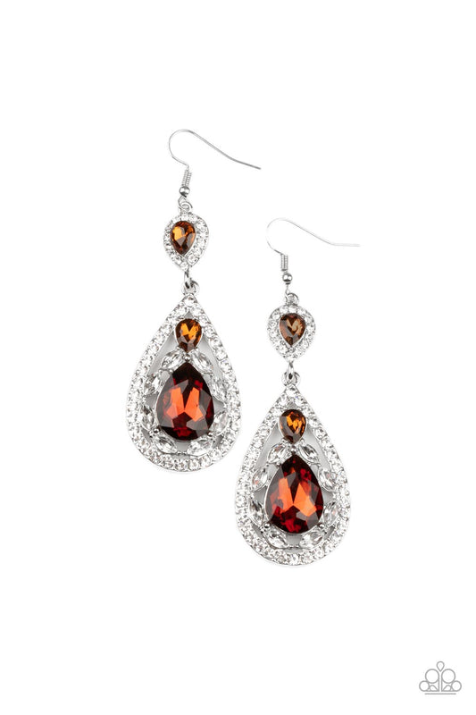 Three teardrop topaz rhinestones adorn white rhinestone encrusted silver frames that link into an elegant teardrop lure for a flawless fashion. Earring attaches to a standard fishhook fitting.  Sold as one pair of earrings.