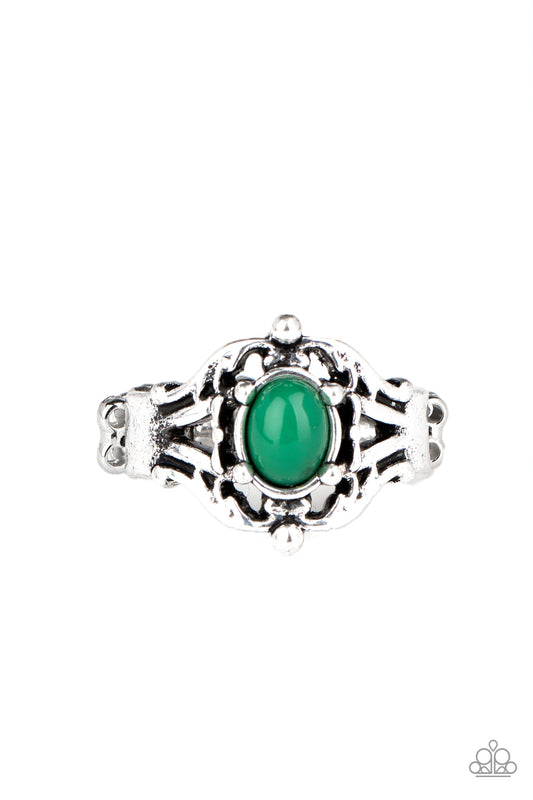 A dainty green bead is pressed into the center of a decoratively layered silver frame, creating a perfect pop of color atop the finger. Features a dainty stretchy band for a flexible fit.  Sold as one individual ring.