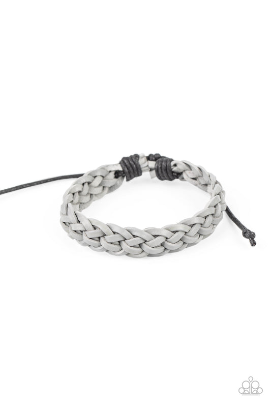 Rustic gray leather laces boldly weave around the wrist, creating a colorfully rugged centerpiece. Features an adjustable clasp closure.  Sold as one individual bracelet.