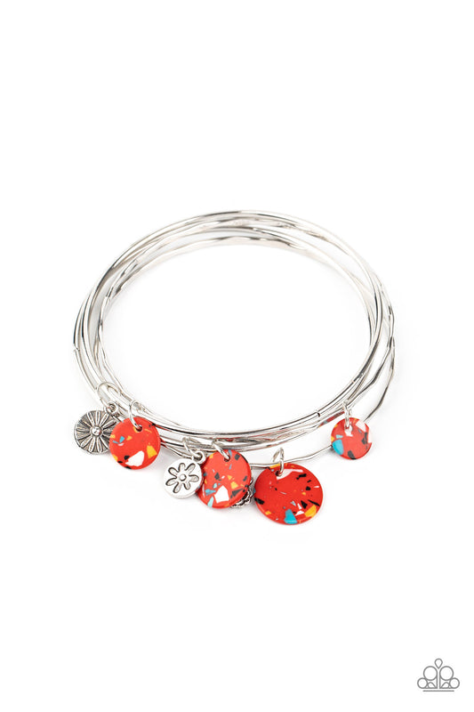 Infused with mismatched silver floral charms and vivaciously speckled red stone discs, a stack of hammered silver bangles slides along the wrist for a colorful earthy look.  Sold as one set of four bracelets.