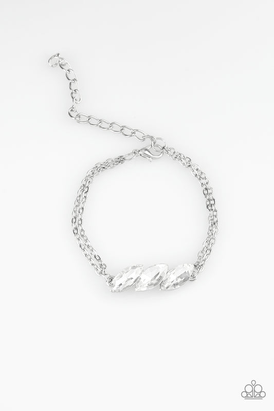 Featuring regal marquise-cuts, a trio of glittery white rhinestones join across the center of the wrist for a timeless look. Features an adjustable clasp closure.

Sold as one individual bracelet.