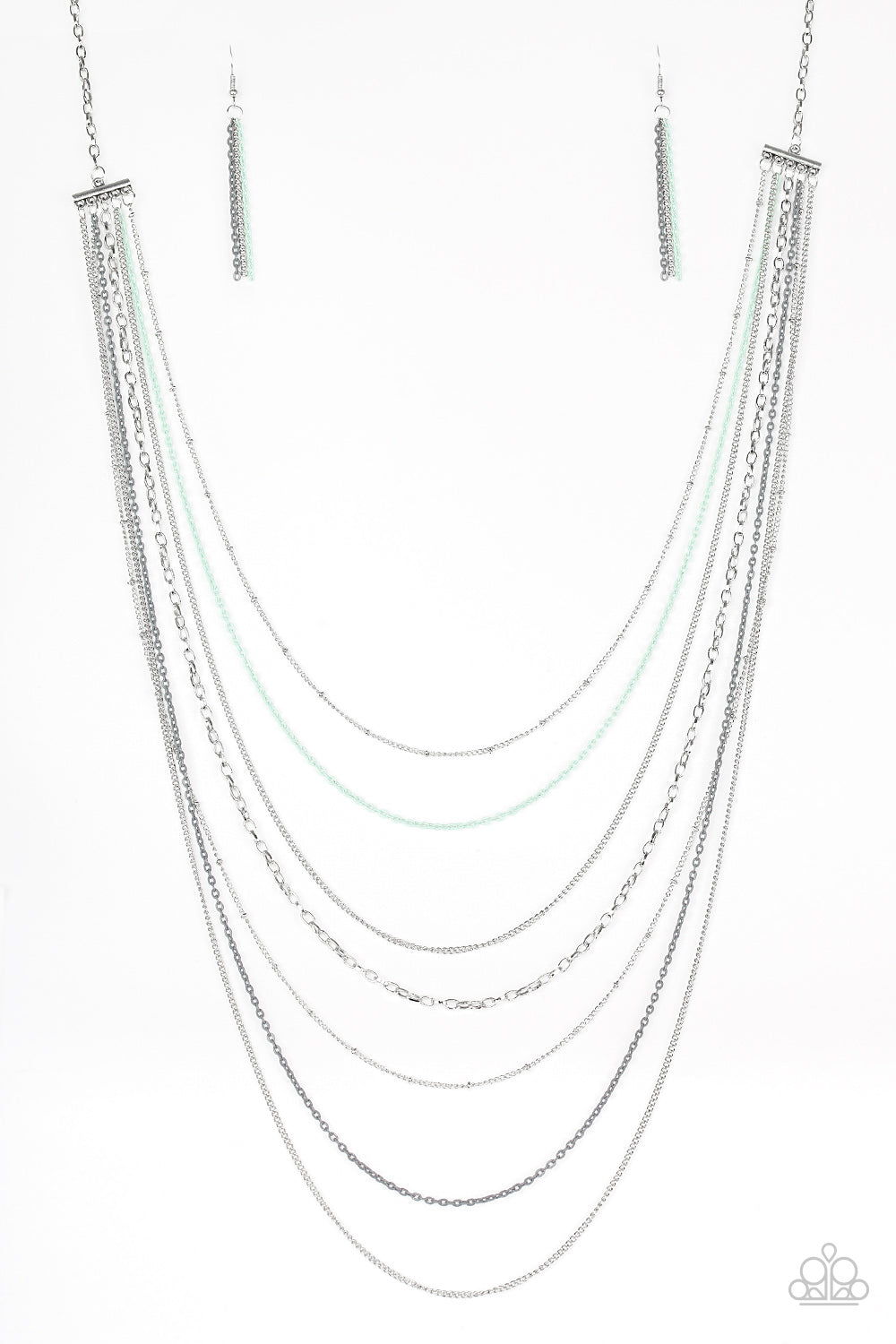 Mismatched silver chains alternate with dainty gray and green chains down the chest, creating a colorful industrial look. Features an adjustable clasp closure.  Sold as one individual necklace. Includes one pair of silver fringe earrings.